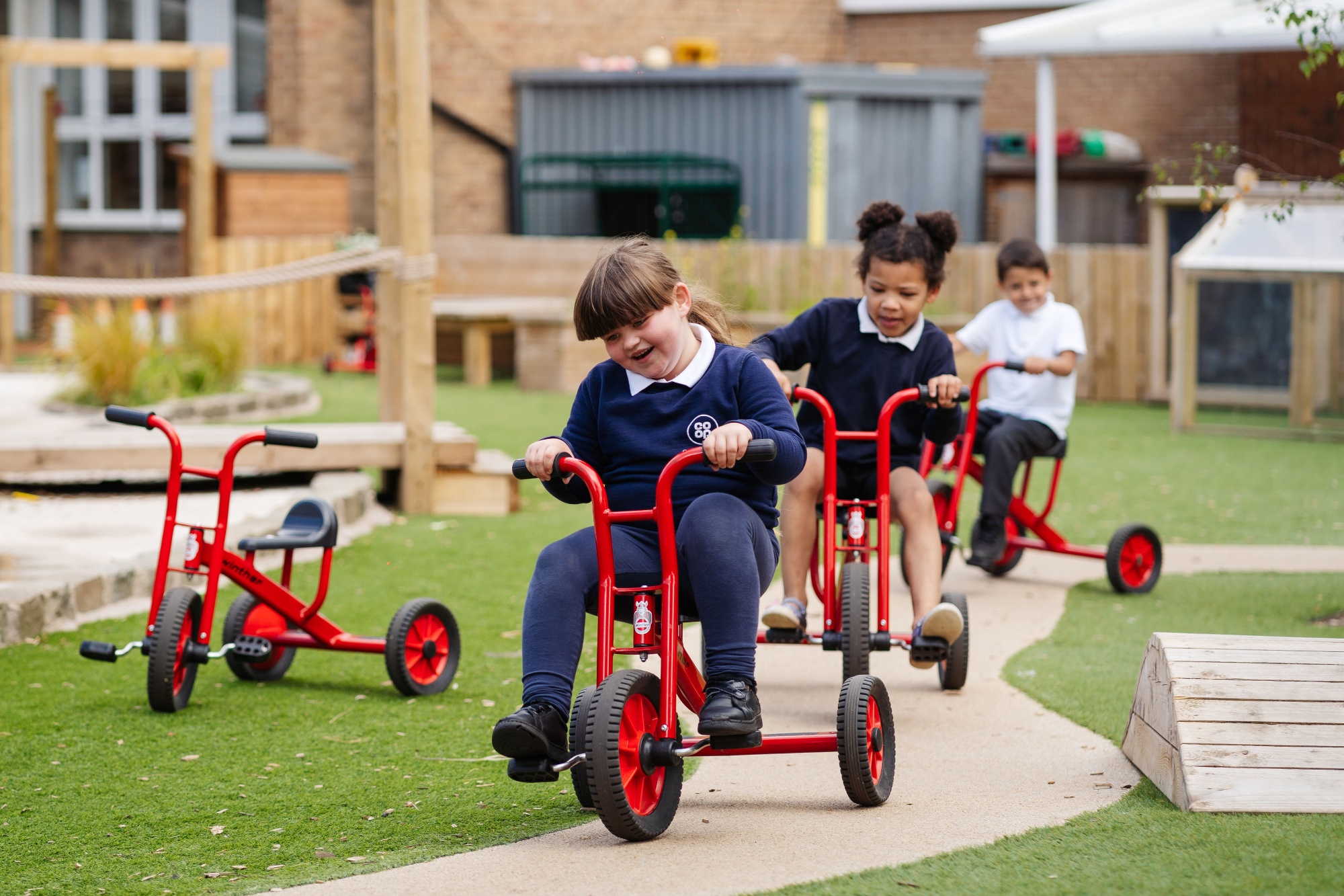 Picture of reception children in the vibrant outdoor space